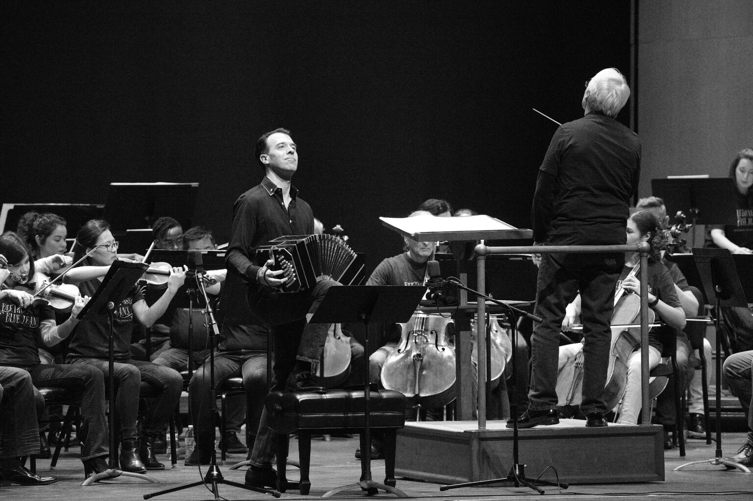 Julien Labro performing on bandoneon with orchestra and conductor