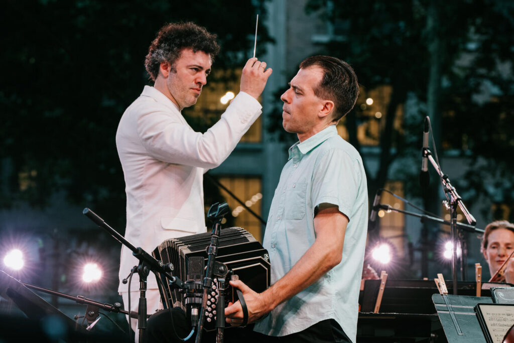Julien Labro performing bandoneon with orchestra and conductor