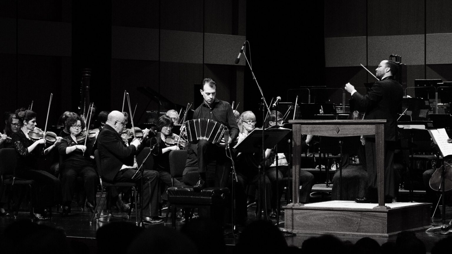 Julien Labro performing on bandoneon with orchestra and conductor