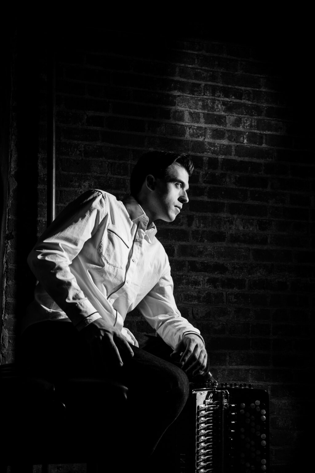 Julien Labro seated with an accordion