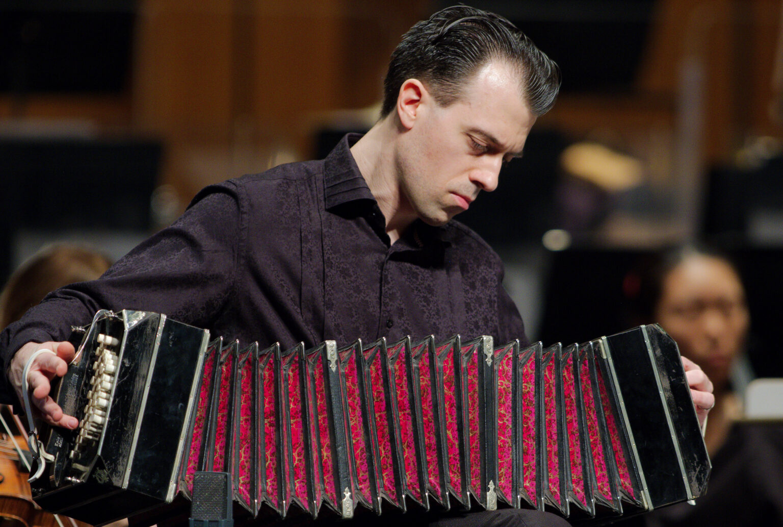Julien Labro performing on bandoneon with orchestra