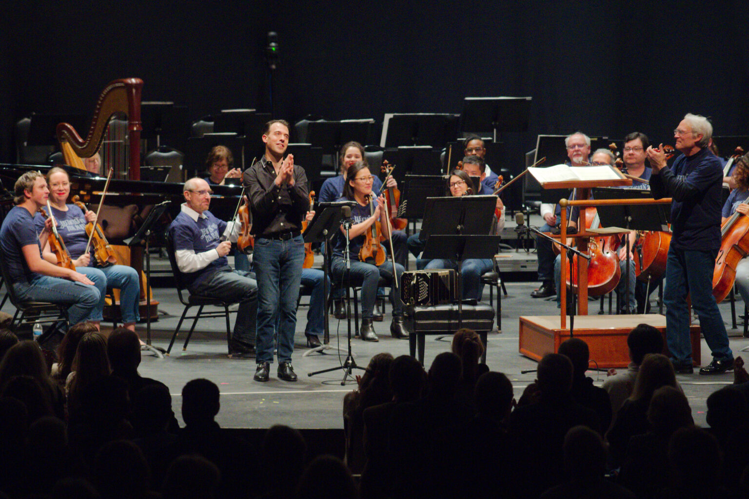 Julien Labro on stage with orchestra and conductor