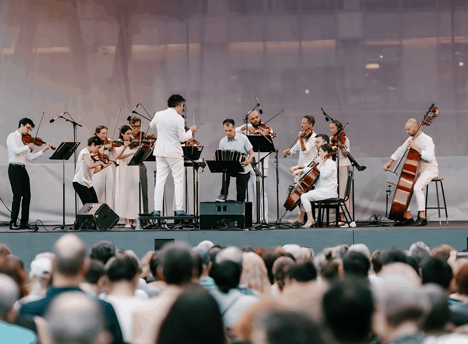 Julien Labro performing bandoneon with string orchestra and conductor