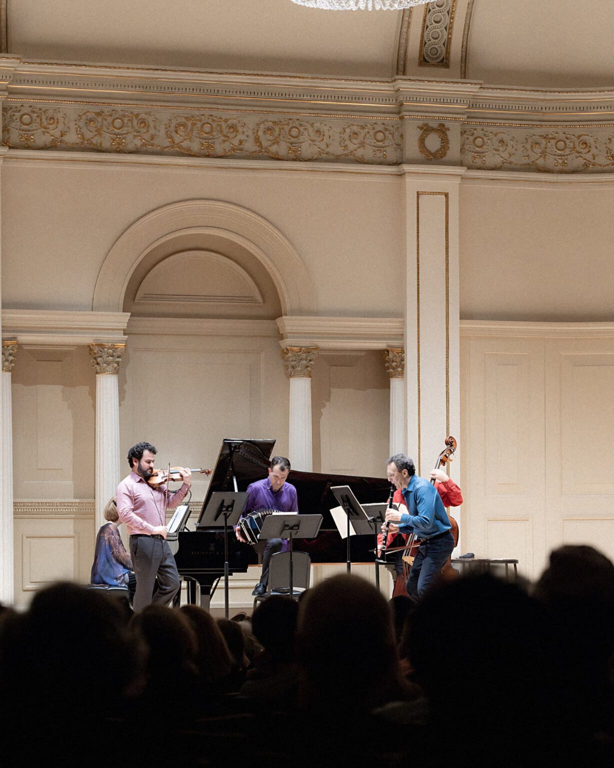 Julien Labro performing bandoneon with a chamber ensemble in a concert hall